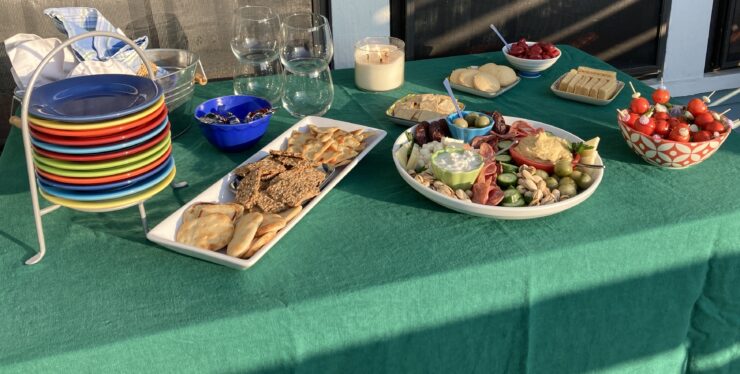 Table of food including skewers.